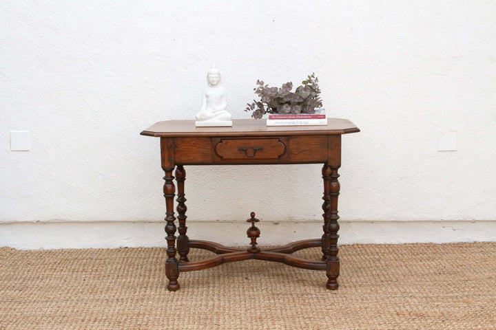 19th Century French Walnut Antique Writing Table on woven rug with floral decor and book