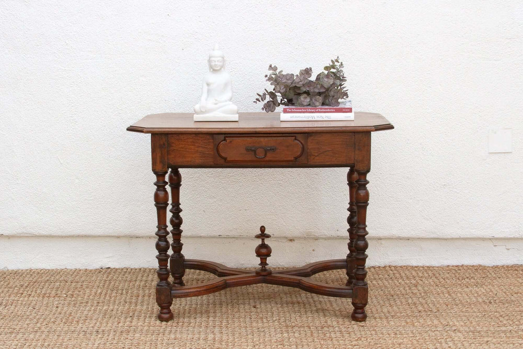 19th Century French Walnut Antique Writing Table with intricate design and decorative items on top, showcasing elegant craftsmanship.