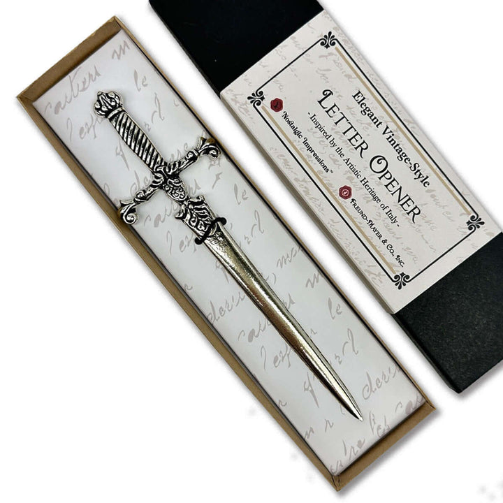 Silver letter opener in a decorative box with a vintage-style design.
