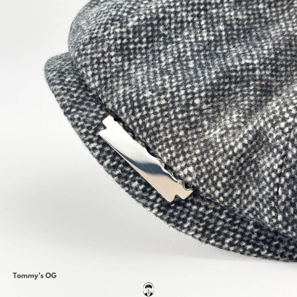 Peaky Blinders Inspired Wool Flat Cap with vintage razor accessory, showcasing rugged elegance and classic style.