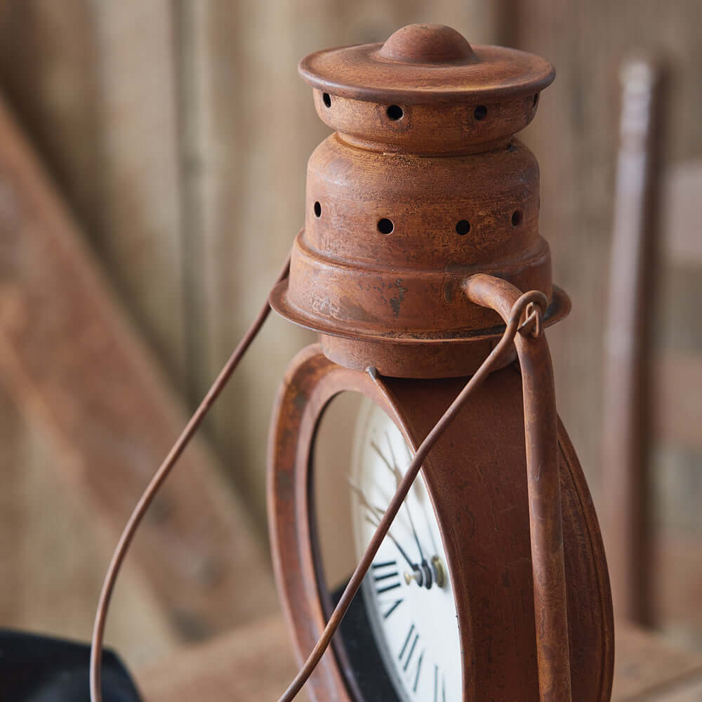 Vintage farmhouse lantern clock with rust-finished metal and classic design, evoking nostalgic homestead and railway vibes