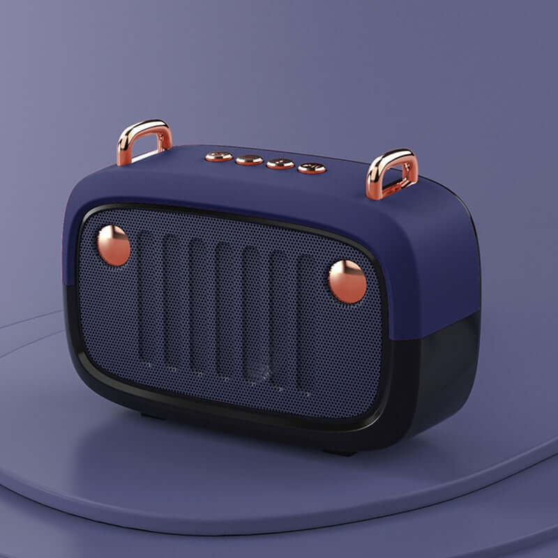 Blue and rose gold portable speaker on a purple background