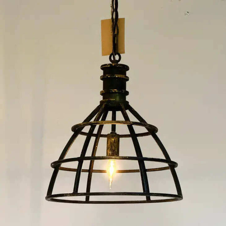 Vintage industrial cage pendant light in rustic metal with a warm glow, perfect for adding charm to any space.