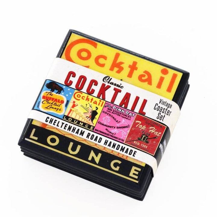 Packaged set of cocktail-themed coasters with colorful labels on a white background