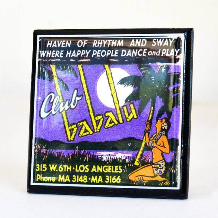 Decorative coaster for Club Vavau with palm trees, moon, and dancer on a purple background.