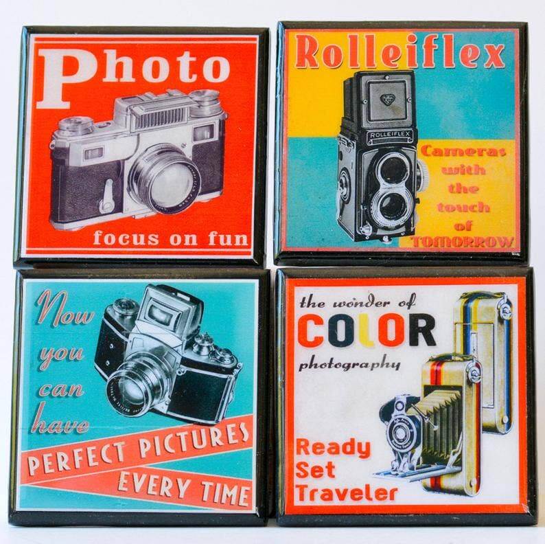Four vintage camera-themed coasters with different camera illustrations and text.