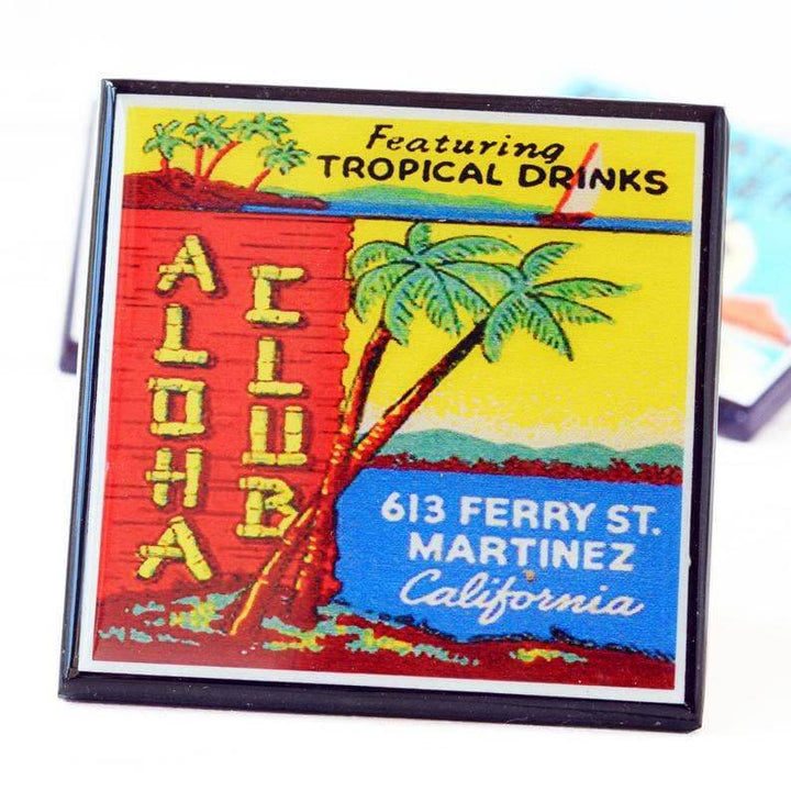 Colorful coaster for Aloha Club with tropical drinks and palm tree design.