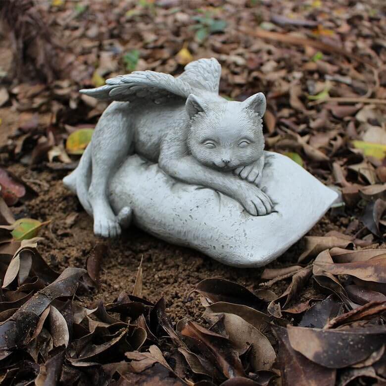 Angelic Cat Memorial Statue with angel wings resting on a cushion, perfect for honoring beloved feline companions.