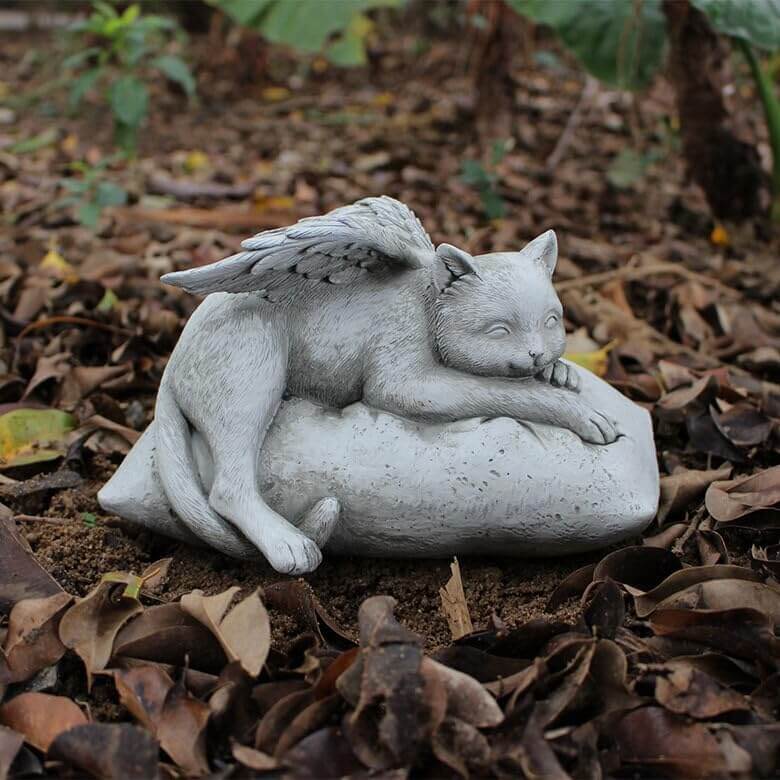 Angelic Cat Memorial Statue, a serene cat figurine resting on a cushion with wings, perfect for pet remembrance.