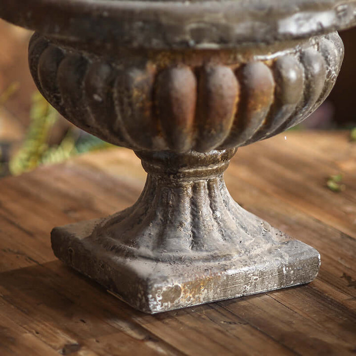 Decorative urn on a wooden surface
