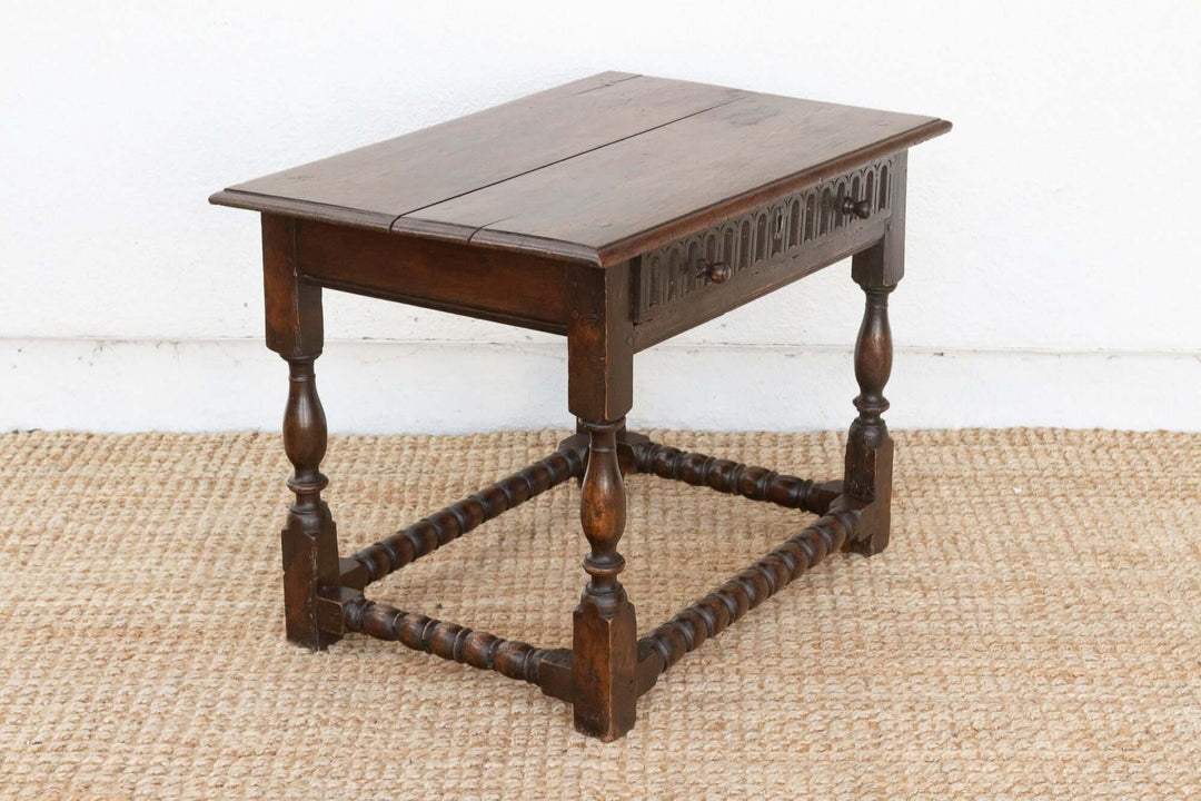 Wooden table with a white wall and jute rug background