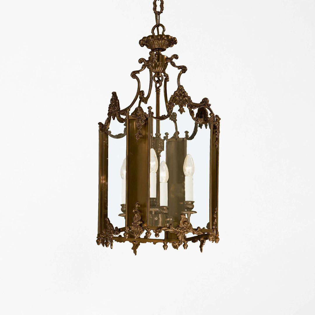 Decorative brass chandelier on a white background