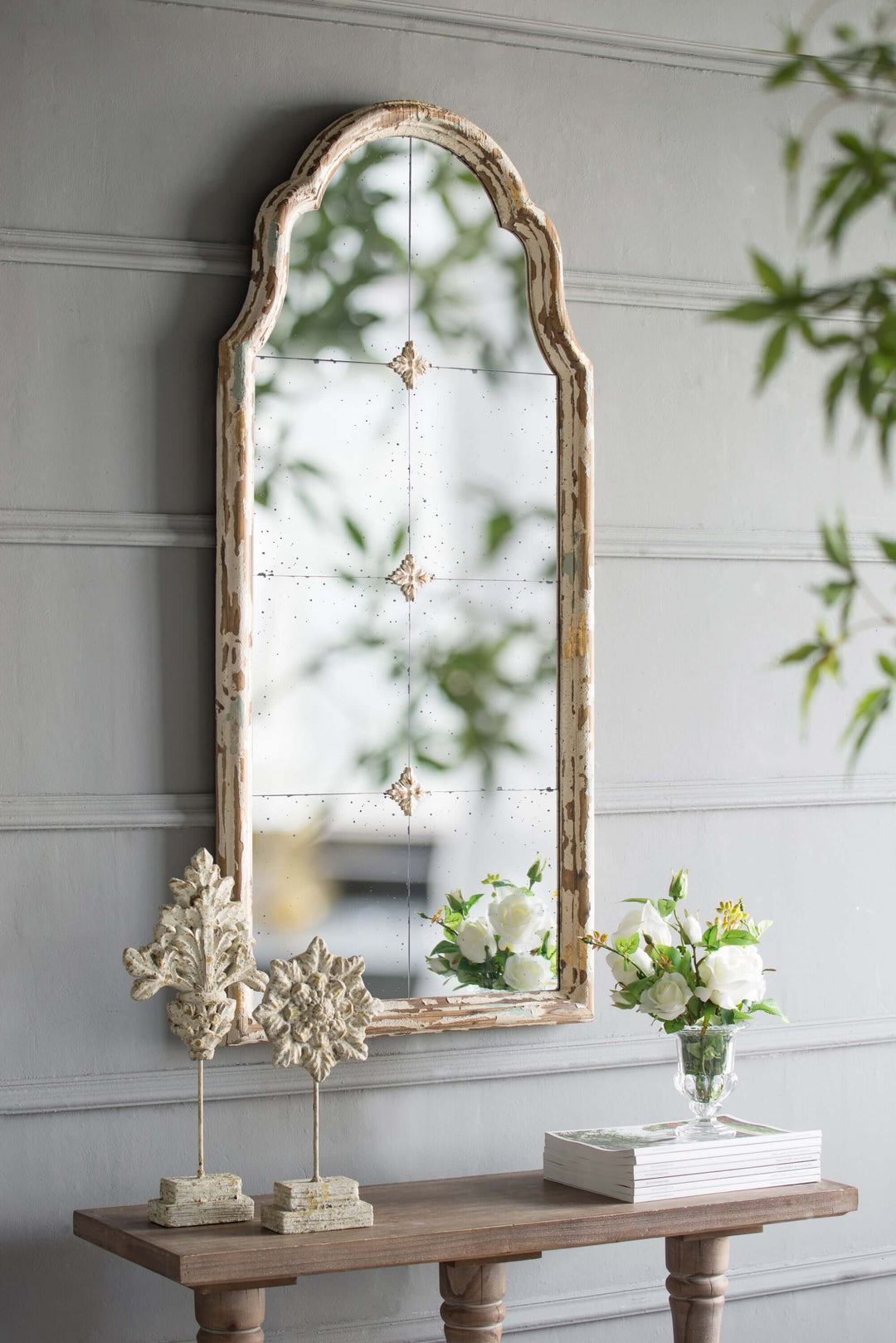 Antique Cream & Gold Arched Wall Mirror in French Country style on a decorated console table.