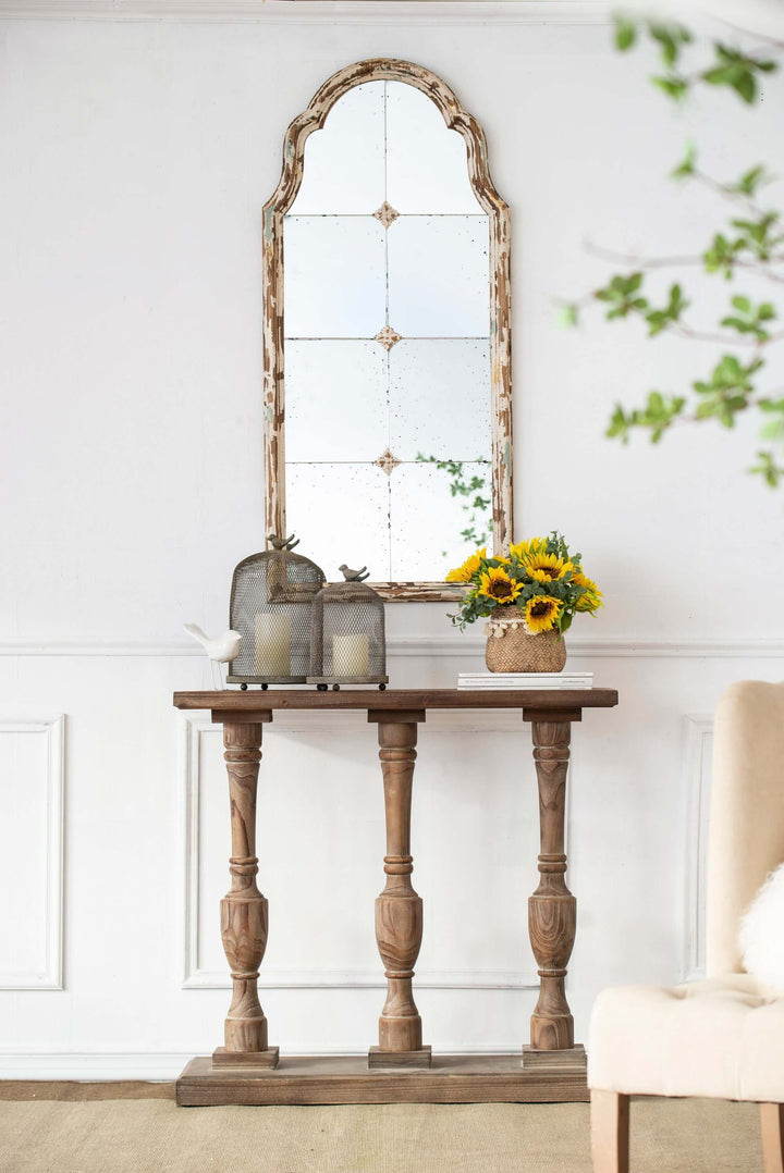 Entryway with Antique Cream & Gold Arched Wall Mirror over rustic wooden console table