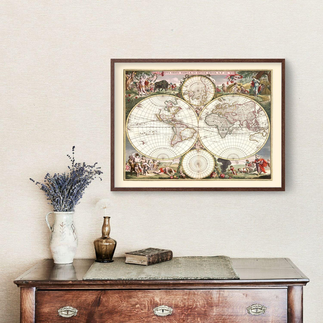 Framed world map on a wall above a wooden dresser with decorative items.