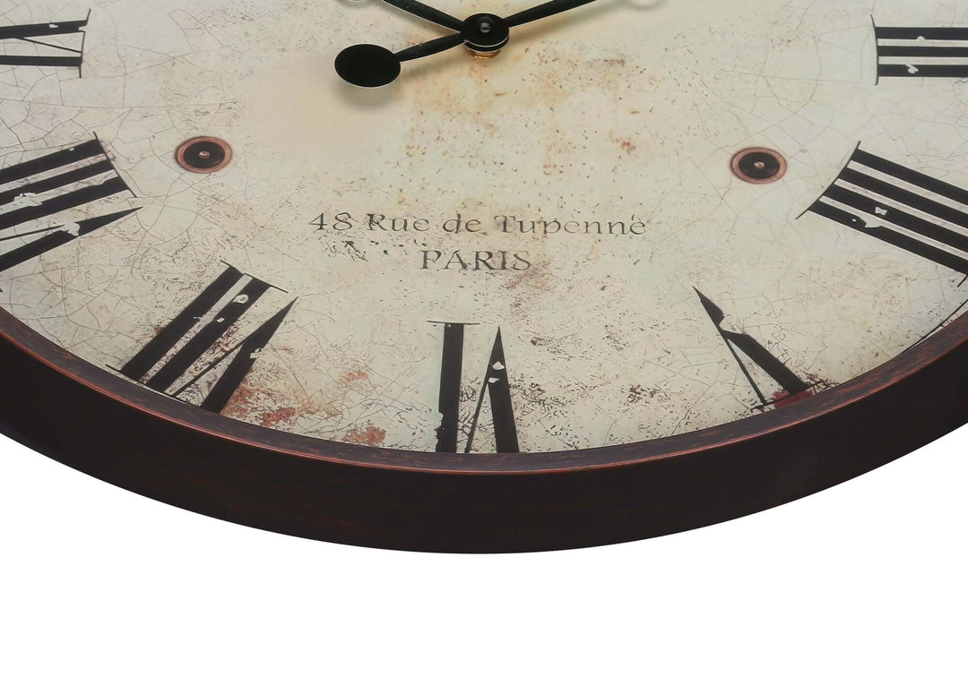 Close-up of a vintage-style clock face with Roman numerals and '48 Rue de Tuponné PARIS' text.