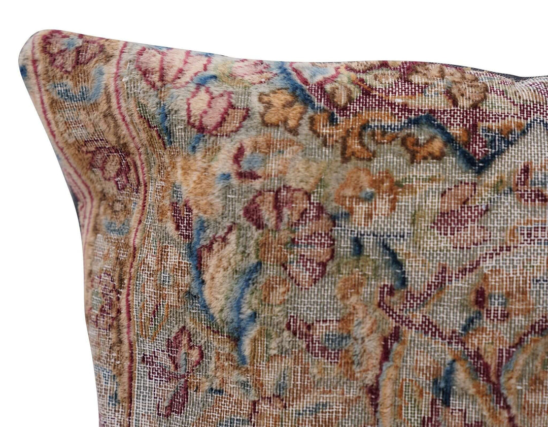 Close-up of a patterned fabric with intricate designs on a white background