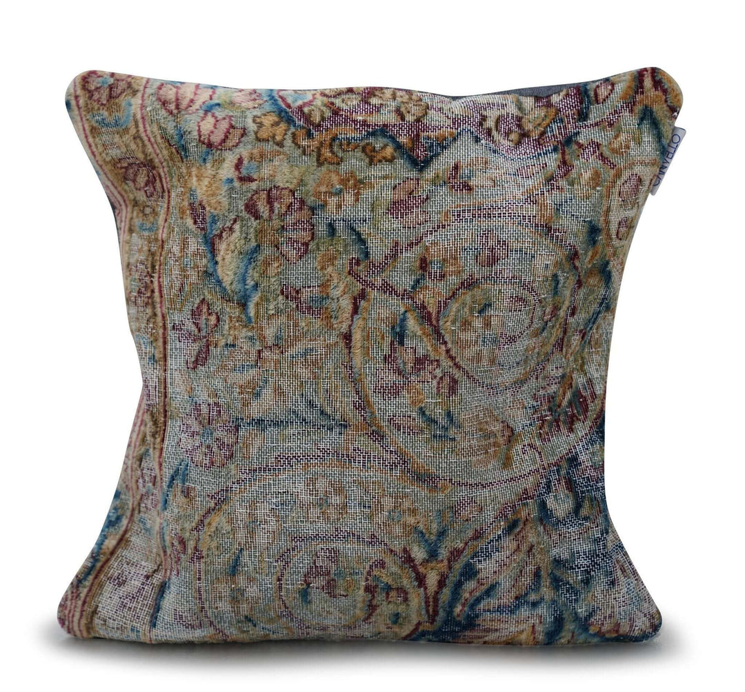 Decorative pillow with intricate paisley pattern on a white background