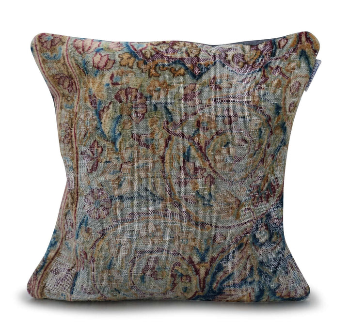 Decorative pillow with intricate paisley pattern on a white background