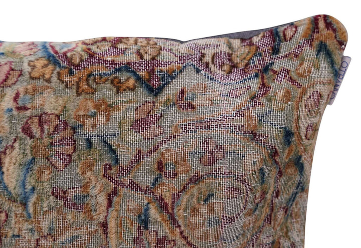 Decorative pillow with intricate floral pattern on a white background