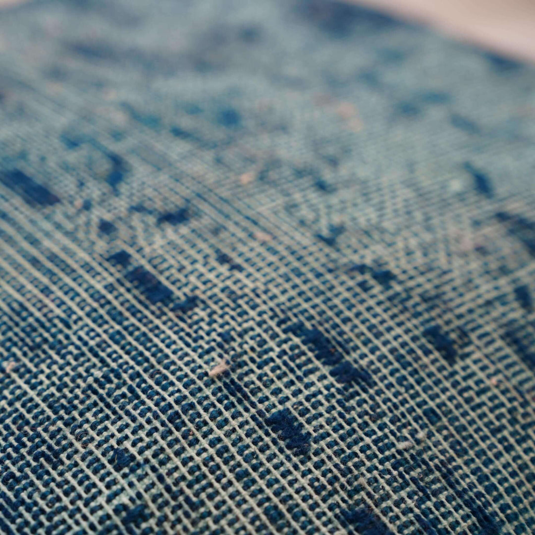 Close-up of a textured blue fabric surface