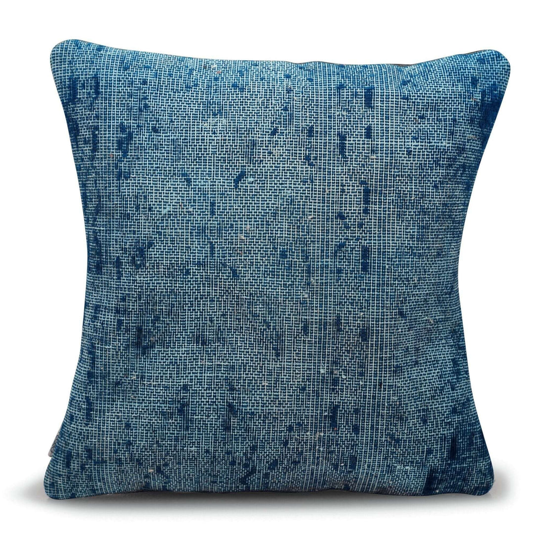 Blue textured pillow on a white background