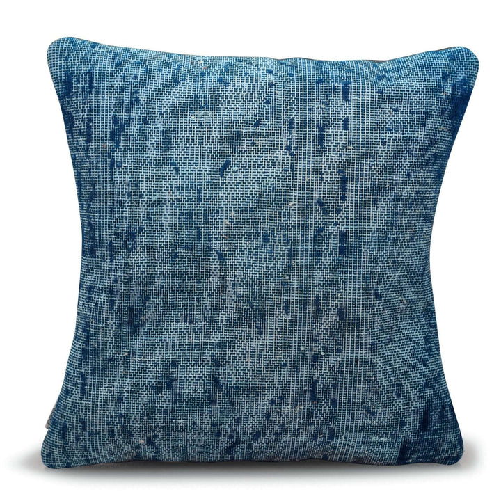 Blue textured pillow on a white background