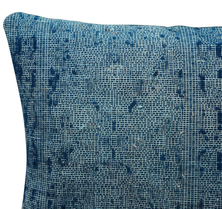 Blue textured pillow on a white background