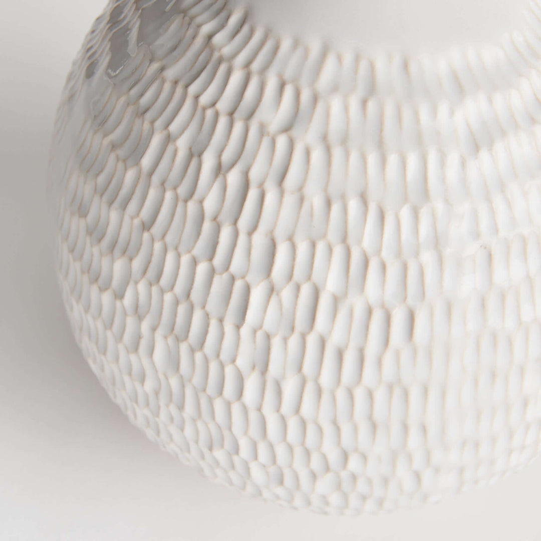Closeup of the texture of the Artisan Vintage-Style White Ceramic Accent Vase