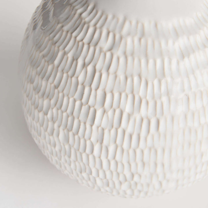 Closeup of the texture of the Artisan Vintage-Style White Ceramic Accent Vase