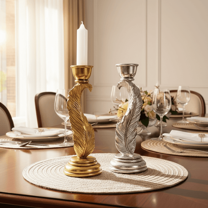 Decorative candle holders on a table setting with plates and glasses.