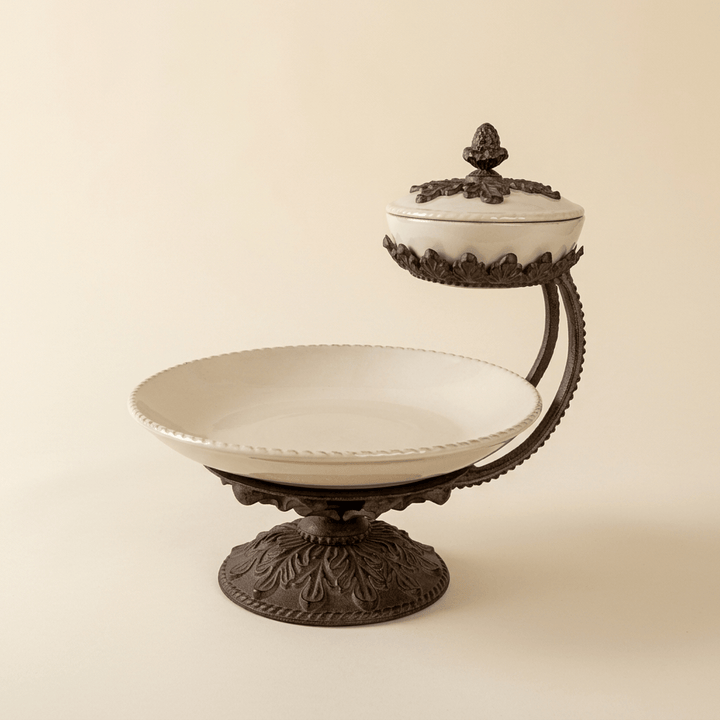 Bellavita cream stoneware chip and dip server with ornate dark metal pedestal on an ivory background