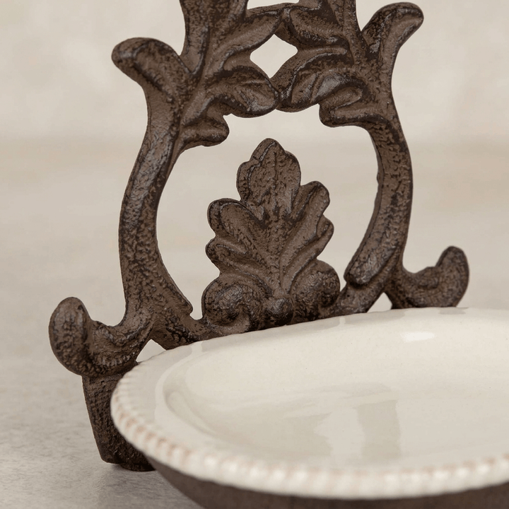 Close-up of Bellavita soap dish acanthus metal detailing and textured cream ceramic rim