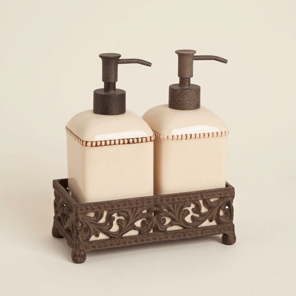 Two cream ceramic pump dispensers in an ornate dark brown metal holder on an ivory background