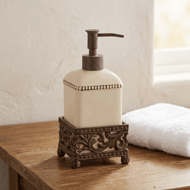 Bellavita cream dispenser on a wooden guest bathroom washstand beside a white towel