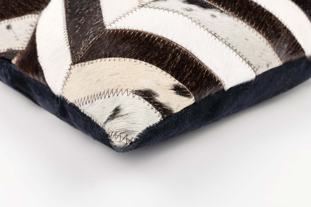 Close-up of black and white cushion on a white background