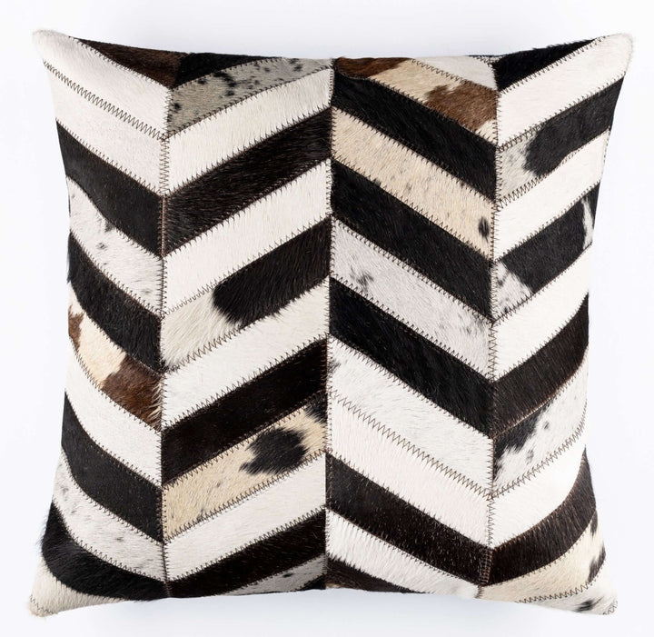 Decorative pillow with black, white, and brown chevron pattern on a white background
