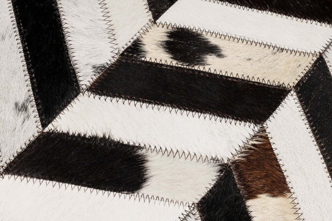 Close-up of a cowhide pillow with a geometric pattern