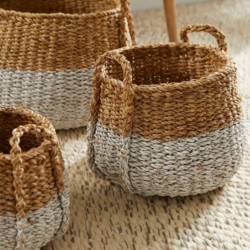 Boho Coastal Storage Baskets with Handles on a carpet
