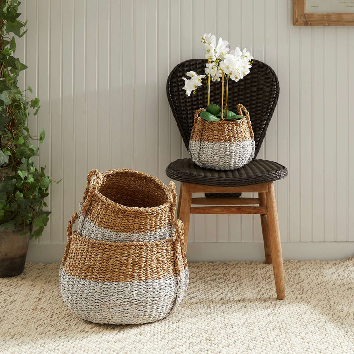 Boho Coastal Storage Baskets positioned in a living room with one on a chair