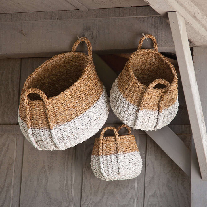 Boho Coastal Storage Baskets with Handles hanging from hooks