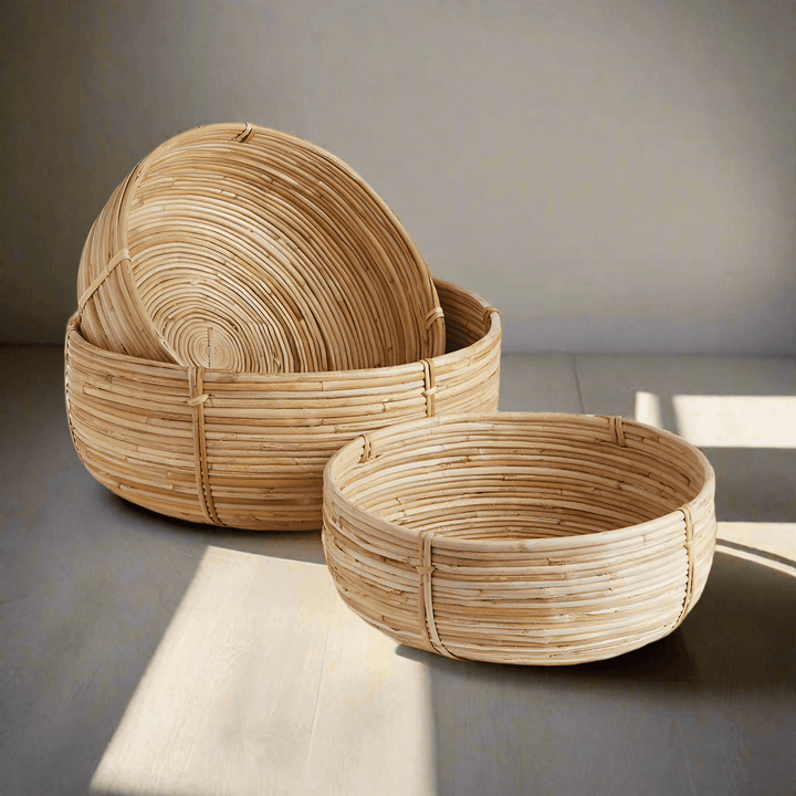Boho Round Cane Rattan Nesting Bowls on floor with sunlight and shadows