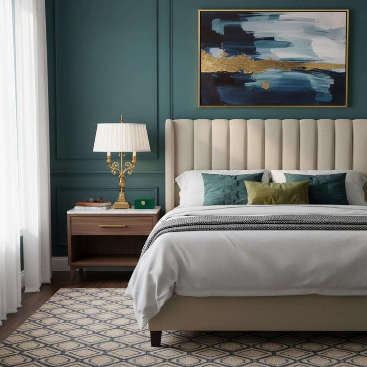 Modern bedroom with a bed, nightstand, and abstract painting on a green wall.