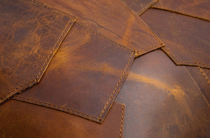Close-up of brown leather with visible stitching