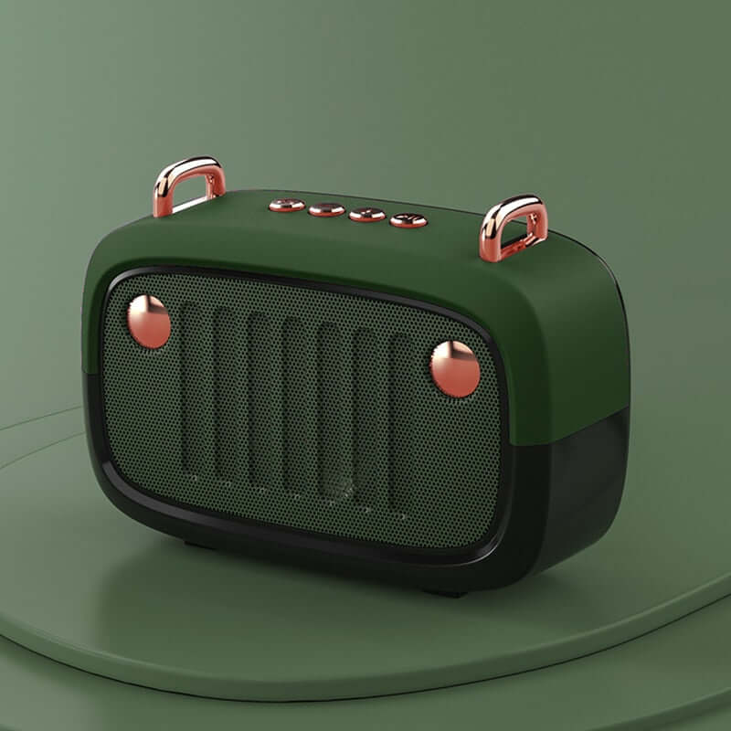 Green and rose gold portable speaker on a green background