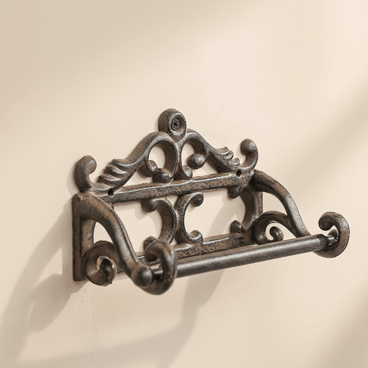 Black Antique-Style Cast Iron Toilet Paper Holder on a beige background
