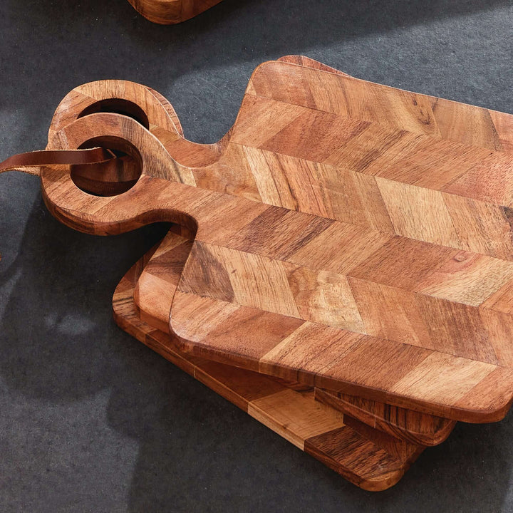 Chevron Acacia Wood Mini Serving Boards stacked on top of each other, on a table from above