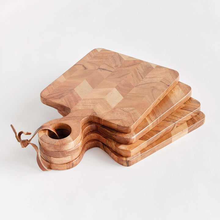 Chevron Acacia Wood Mini Serving Boards stacked up on a white surface