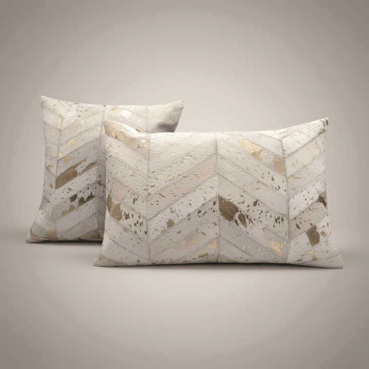 Two decorative pillows with a chevron pattern on a neutral background