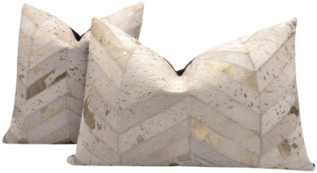 Two decorative pillows with geometric pattern on a white background